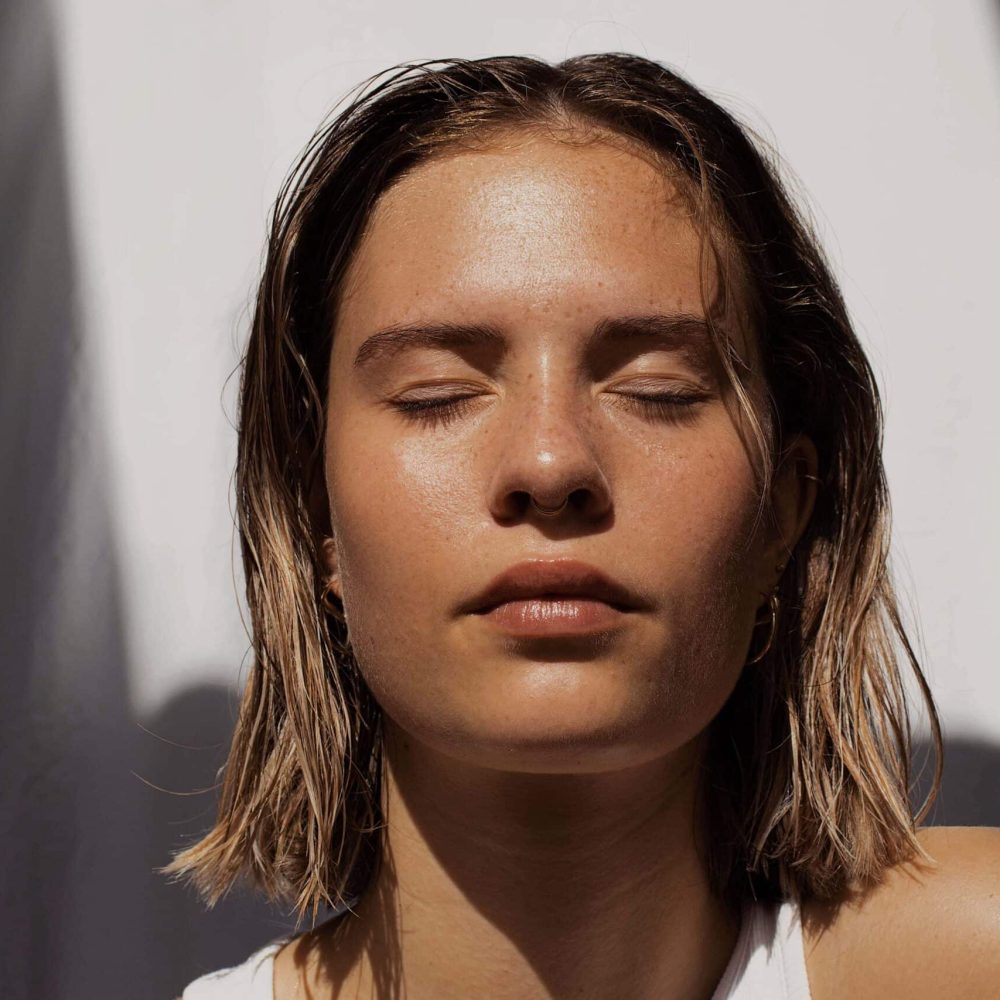 model with eyes closed