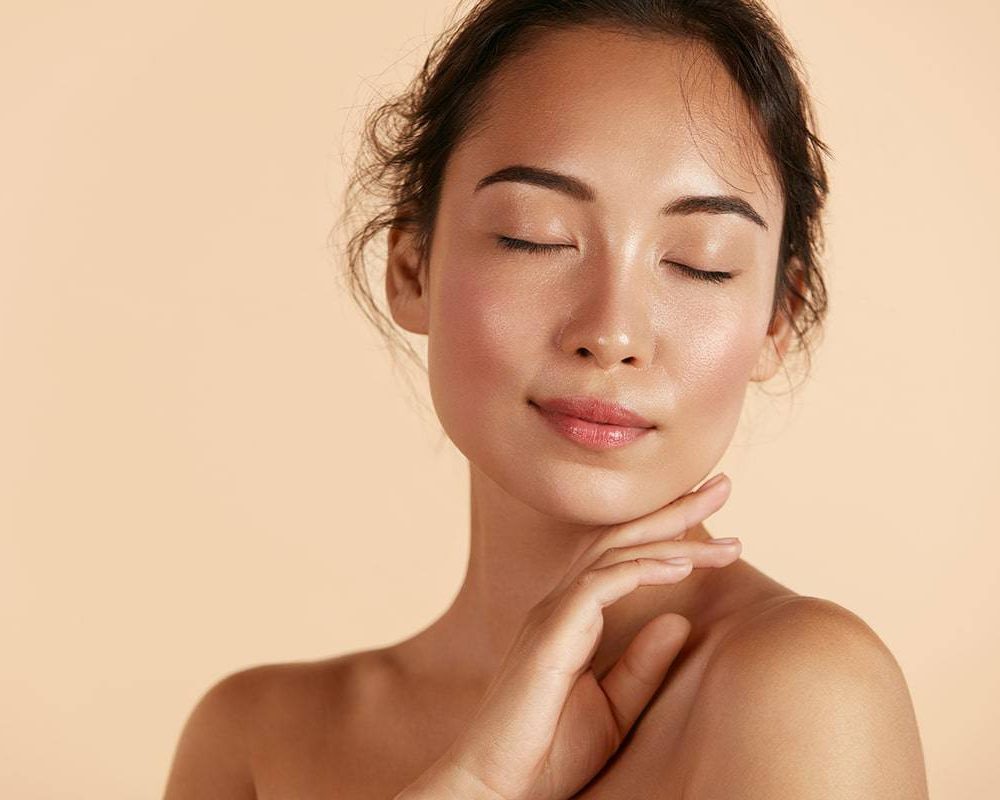 model posing with eyes closed