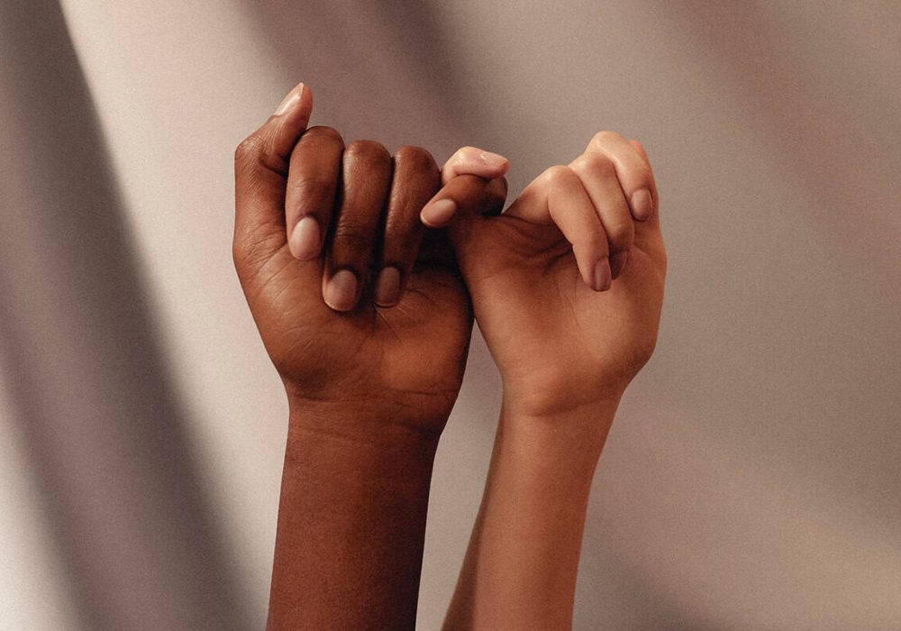 two hands locking pinkies